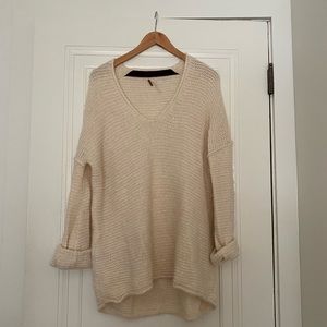 Free People cream knit sweater.